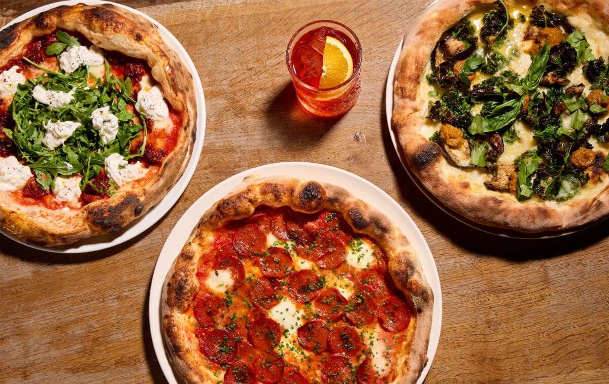 Delicious sourdough wood fired pizzas on a table