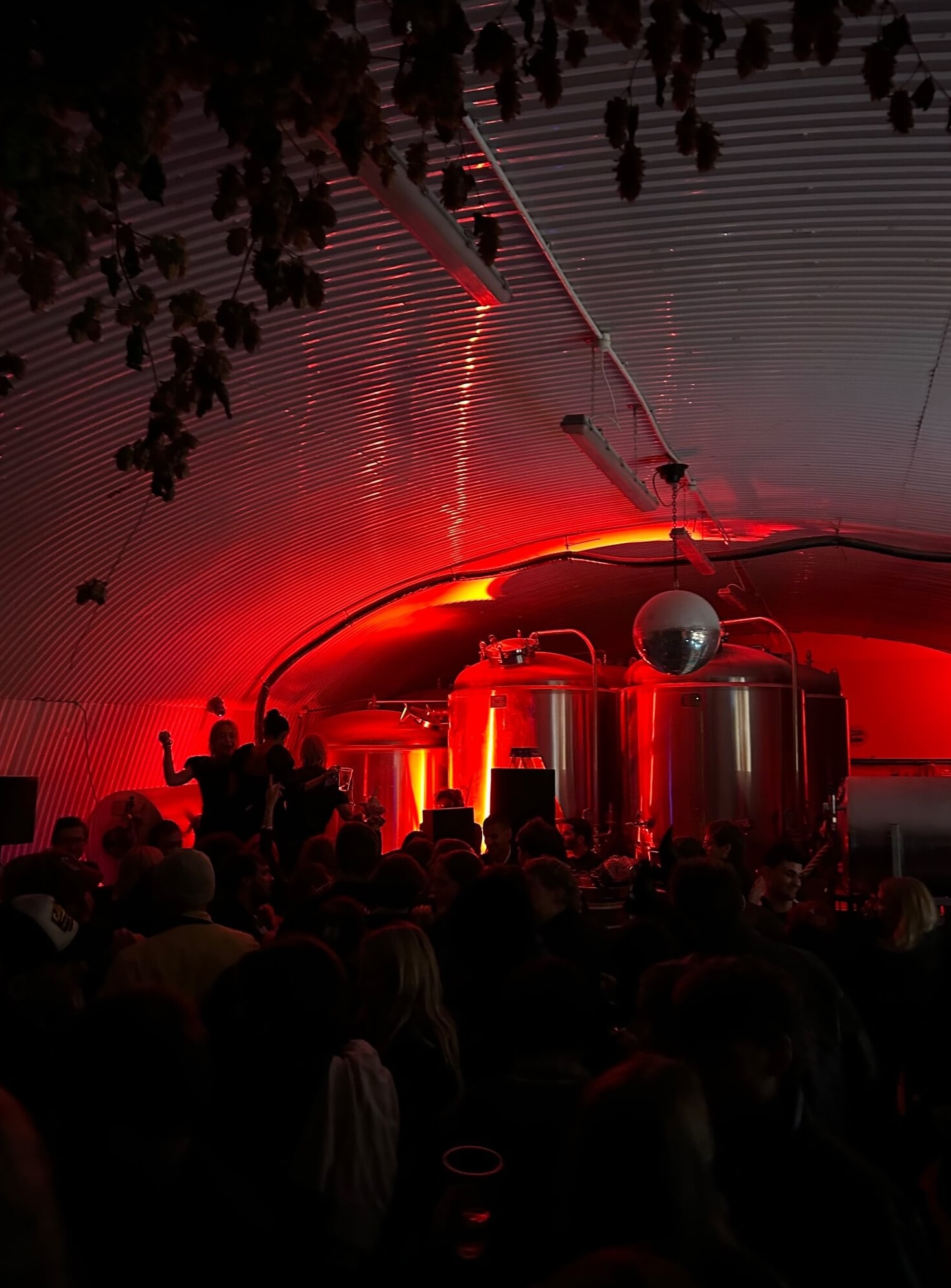 Crowded weekend atmosphere with people dancing in the event space